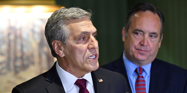 Lou Barletta speaks at a news conference where he accepted the endorsement of a rival in Pennsylvania's crowded Republican primary for governor, Jake Corman, right, May 12, 2022, in Harrisburg, Pa. (AP Photo/Marc Levy)