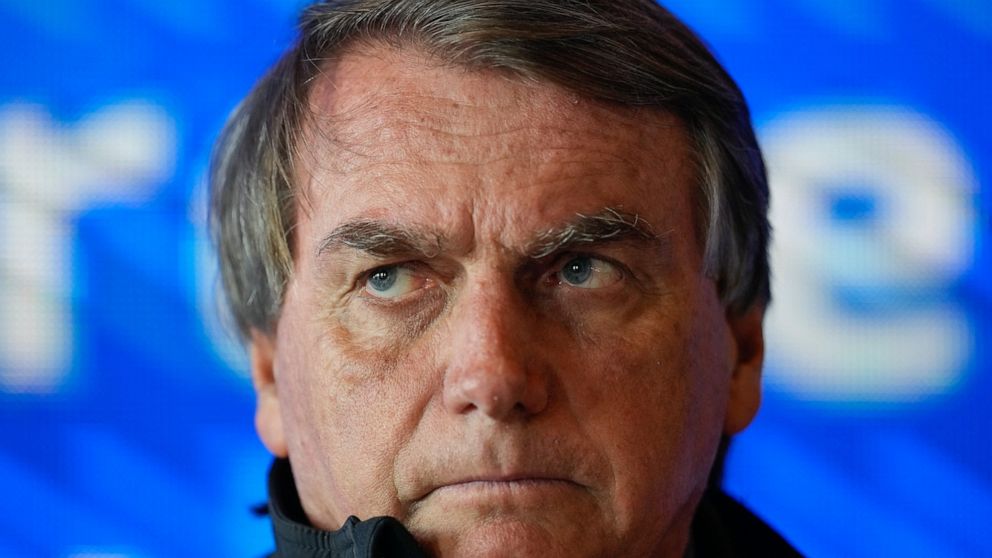 Brazil's President Jair Bolsonaro gives a press conference after meeting with Elon Musk in Porto Feliz, Brazil, Friday, May 20, 2022. Musk, the Telsa and SpaceX chief executive officer, tweeted that he was in Brazil to help bring Internet service to