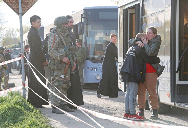 Civilians evacuated from Ukraine's Mariupol but many remain trapped