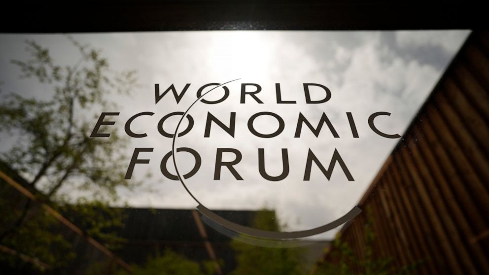 The logo of the World Economy Forum is displayed at a window of the venue prior to the opening of the event in Davos, Switzerland, Sunday, May 22, 2022. The annual meeting of the World Economy Forum is taking place in Davos from May. 22 until May. 26