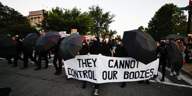Antifa gathers outside the Supreme Court following the landmark ruling overturning Roe v. Wade.