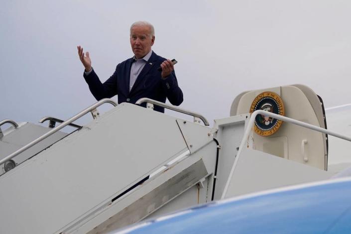 President Joe Biden motions before boarding Air Force One at Kirtland Air Force Base in Albuquerque, N.M., in June. (AP Photo/Evan Vucci)