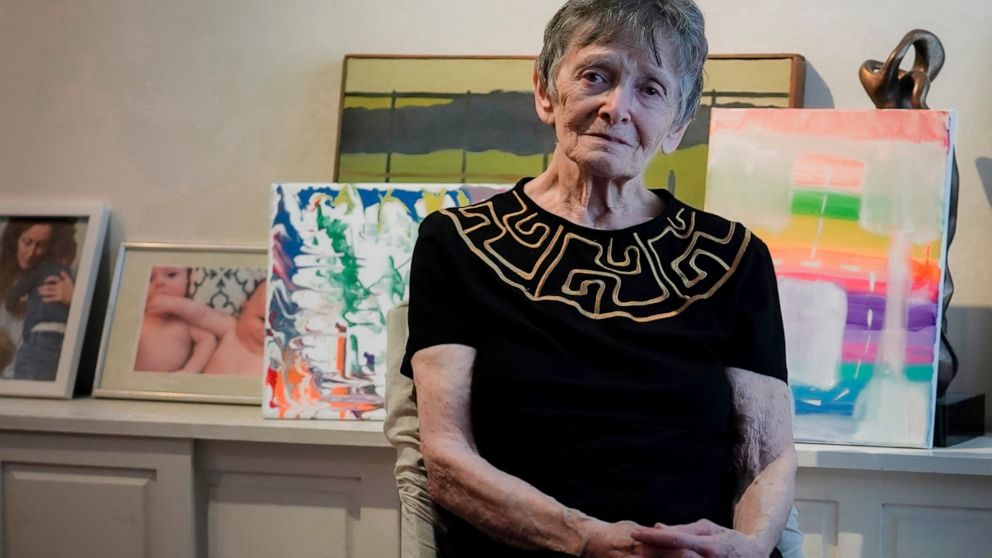 Ellen Ensig-Brodsky, 89, a LGBTQ rights activist, pose in her home, Wednesday, June 22, 2022, in New York. Even with ailing knees, Ensig-Brodsky said she plans to be on the Pride Parade route on Sunday. "The parade is the display, publicly, of my ide