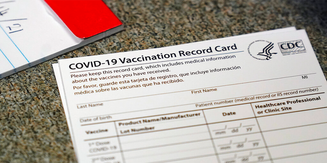 A COVID-19 vaccination record card is shown at Seton Medical Center in Daly City, California, on Dec. 24, 2020. (AP Photo/Jeff Chiu, File)