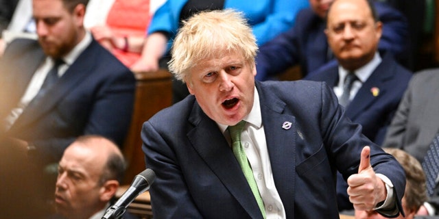 In this photo issued by UK Parliament, Britain's Prime Minister Boris Johnson speaks during Prime Minister's Questions in the House of Commons, London, Wednesday, May 18, 2022.