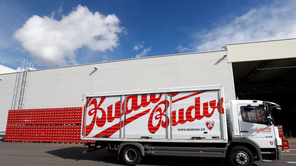 FILE - A truck drives past cases of beer at the Budejovicky Budvar brewery in Ceske Budejovice, Czech Republic, on March 11, 2019. Budvar, the Czech brewer that has been in a long legal dispute with U.S. company Anheuser-Busch over use of the “Budwei