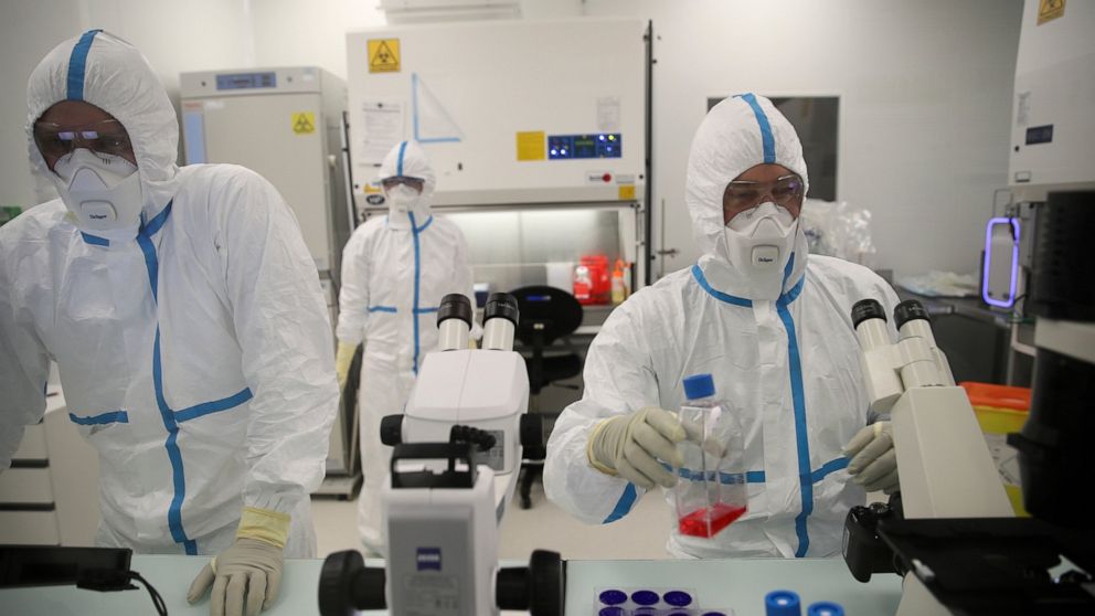 FILE - Laboratory technicians work at the Valneva headquarters in Saint-Herblain, western France, on Feb.3, 2021. The European Medicines Agency said it is recommending the authorization of the coronavirus vaccine made by French pharmaceutical Valneva