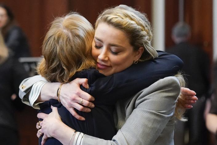 Actor Amber Heard hugs her attorney Elaine Bredehoft after closing arguments at the Fairfax County Circuit Courthouse in Fairfax, Va., on May 27.