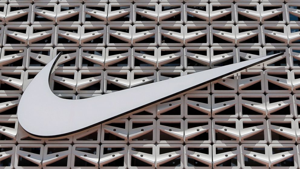 FILE - The Nike logo hangs at a store in Miami Beach, Fla. on Aug. 8, 2017. Nike says it will exit the Russian marketplace, the latest company with plans to leave the country amid the ongoing invasion of Ukraine. The footwear and clothing company sai