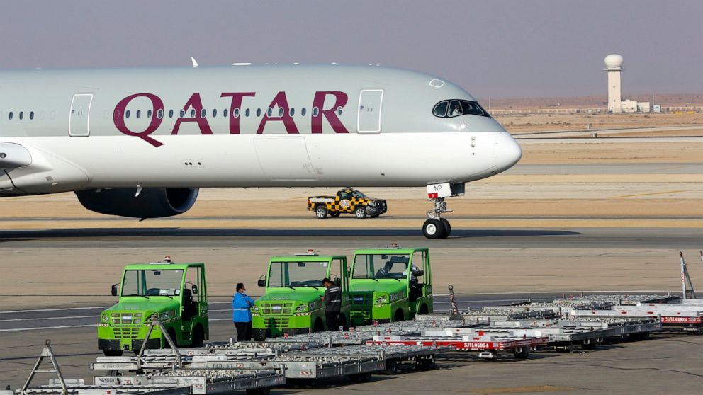 FILE - The first Qatar Airways plane in three years lands at King Khalid Airport in Riyadh, Saudi Arabia, Monday, Jan. 11, 2021. Qatar Airways, one of the Mideast's largest carriers known for on-board comfort and luxury, said Thursday, June 16, 2022