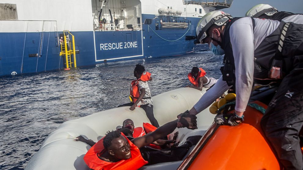 In tis photo released by Doctors Without Borders and taken on June 27, the MSF team rescues 71 people from a rubber boat in distress. A flimsy rubber boat collapsed and sank in the Mediterranean Sea off Libya's coast, leaving at least 30 people inclu