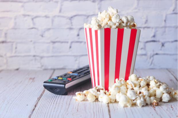 Times Series: Popcorn and a TV remote (Canva)