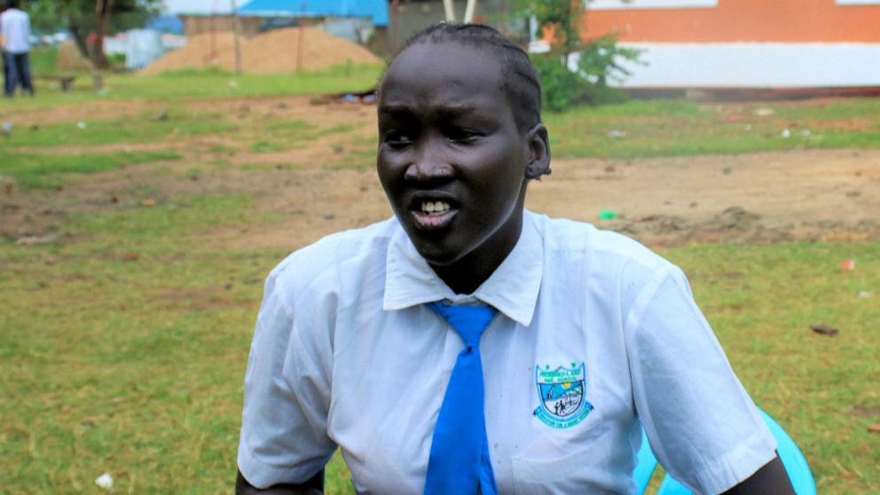 Nyanachiek Madit, 21, who successfully refused when her father told her at age 17 that she would be married off to a man about 50 years old because her family couldn't afford to send her to school, speaks to The Associated Press in Juba, South Sudan