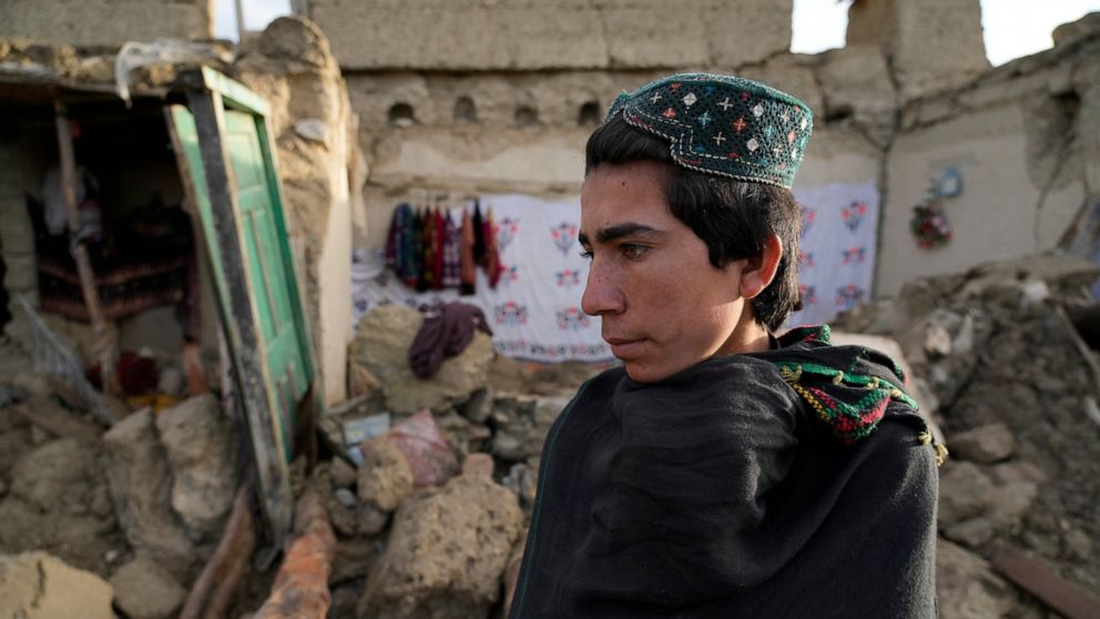 A man stands among destruction after an earthquake in Gayan village, in Paktika province, Afghanistan, Thursday, June 23, 2022. A powerful earthquake struck a rugged, mountainous region of eastern Afghanistan early Wednesday, flattening stone and mud