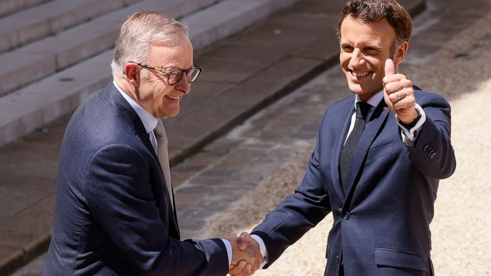 French President Emmanuel Macron, right, and Australian Prime Minister Anthony Albanese shake hands after addressinf reporters Friday, July 1, 2022 at the Elysee Palace in Paris. Australia and France opened a "new chapter" in relations as the new Aus