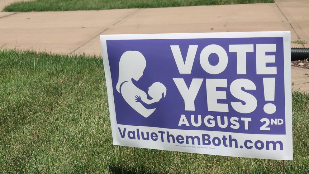 FILE - In this photo from Friday, July 8, 2022, a sign in a yard in Olathe, Kansas, promotes a proposed amendment to the Kansas Constitution to allow legislators to further restrict or ban abortion. Supporters call the measure "Value Them Both," argu