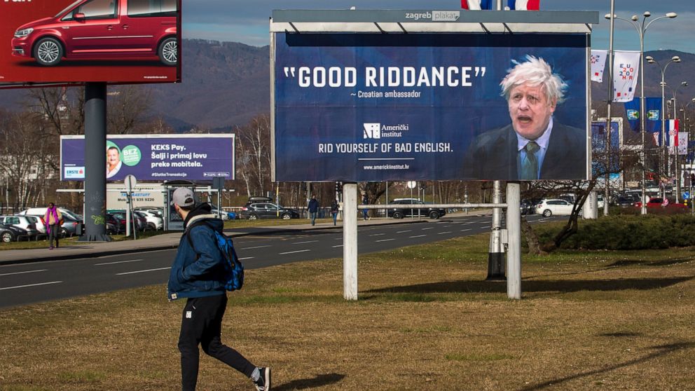 FILE - An advertising billboard for an English language school depicts Britain's prime minister Boris Johnson, in Zagreb, Croatia, Feb. 6, 2020. Outgoing U.K. Prime Minister Boris Johnson has been the bane of Brussels for many years, from his days st