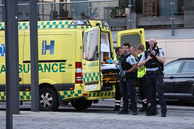 An ambulance and armed police stand outside Field's shopping centre, after Danish police said they received reports of shooting, in Copenhagen