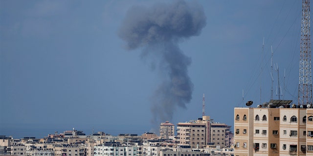 Smoke rises following Israeli airstrikes on a building in Gaza City, Saturday, Aug. 6, 2022.