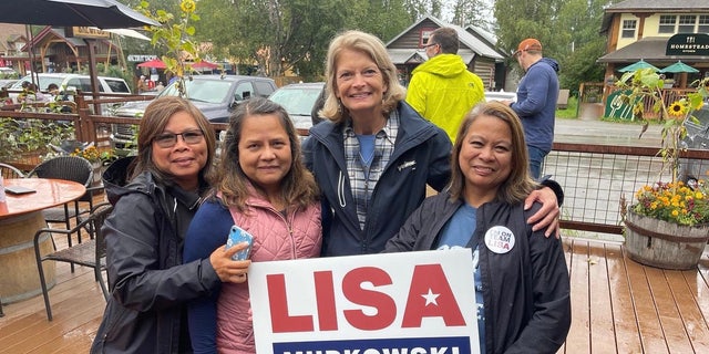 GOP Sen. Lisa Murkowski  takes a picture with supporters in Talkeetna, Alaska, on Aug. 13, 2022.