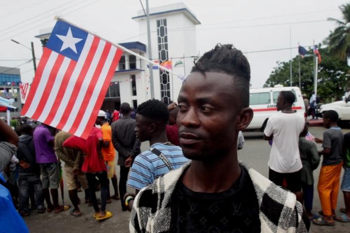 A man wears a flag in Monrovia during Liberian Flag Day, a holiday that was first observed in 1847 when the founding fathers approved the flag's design along with establishing the new republic.