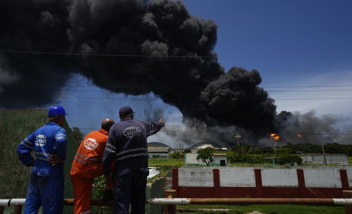 17 missing, 121 hurt as fire rages in Cuban oil tank farm