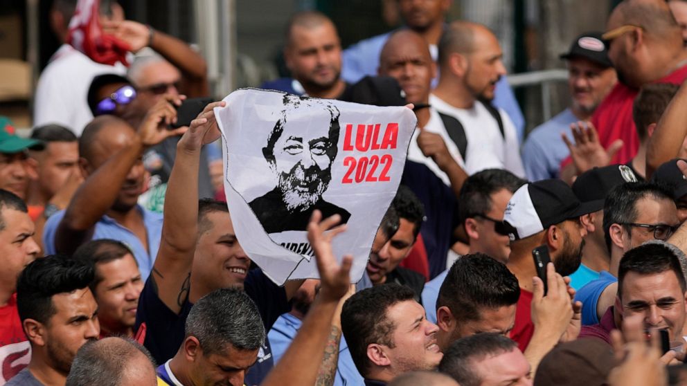 Supporters of Brazil's former President Luiz Inacio Lula da Silva, who is running for reelection, cheer during a campaign rally outside the Volkswagen automaker´s plant in Sao Bernardo do Campo, greater Sao Paulo area, Brazil, Tuesday, Aug. 16, 2022.