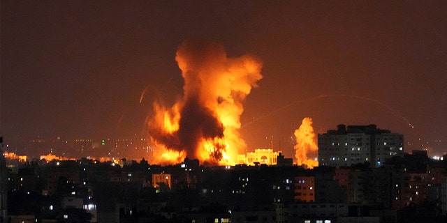 Smoke rises following Israeli airstrikes on a building in Gaza City, Friday, Aug. 5, 2022.