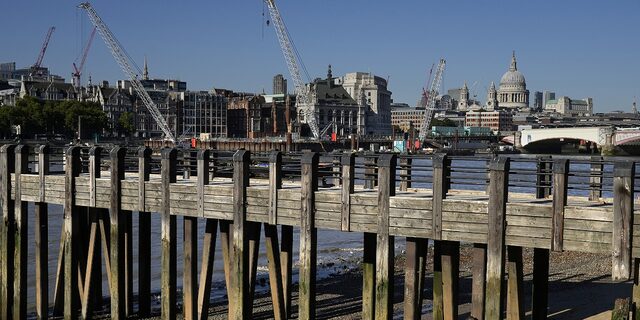 A person sunbathes on the south banks on the Thames River in London, Aug. 11. Heatwaves and prolonged dry weather are damaging landscapes, gardens and wildlife, officials have warned.