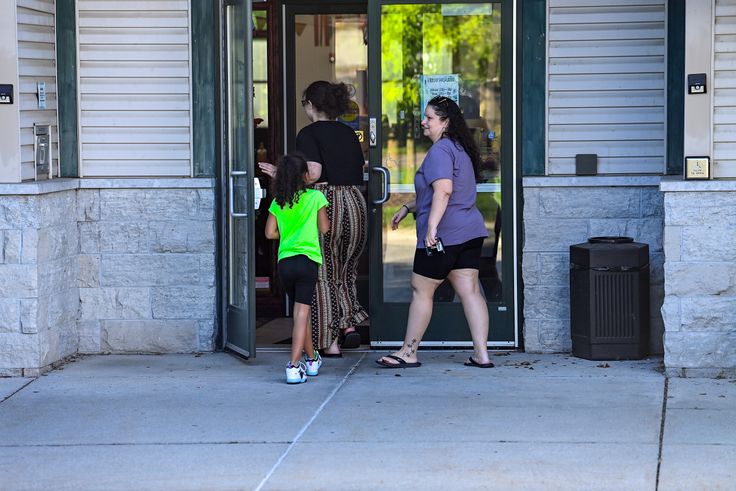 Visitors enter the Patmos Library on August 11 in Jamestown, Michigan.