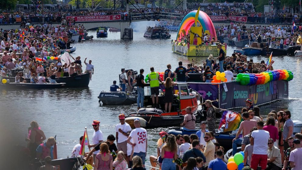 Hundreds of thousands of people lined canals in the Dutch capital to watch the colorful spectacle of the Pride Canal Parade return for the 25th edition after the last two events were canceled due to the COVID-19 pandemic, in Amsterdam, Netherlands, S