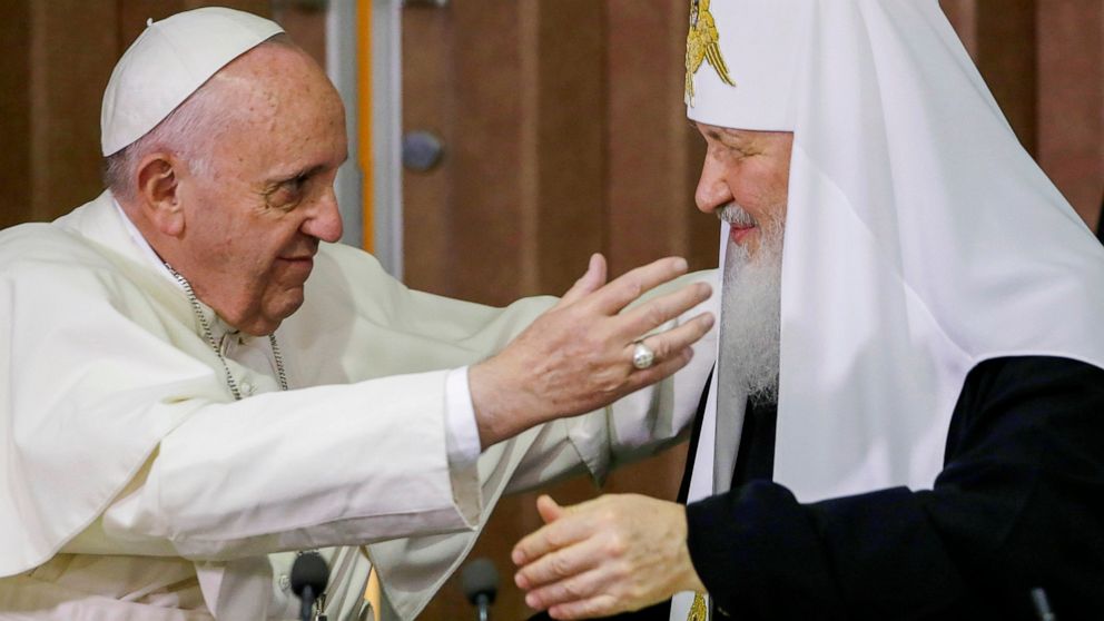 FILE - Pope Francis, left, reaches to embrace Russian Orthodox Patriarch Kirill after signing a joint declaration at the Jose Marti International airport in Havana, Cuba o Feb. 12, 2016. The head of the Russian Orthodox Church has canceled his planne