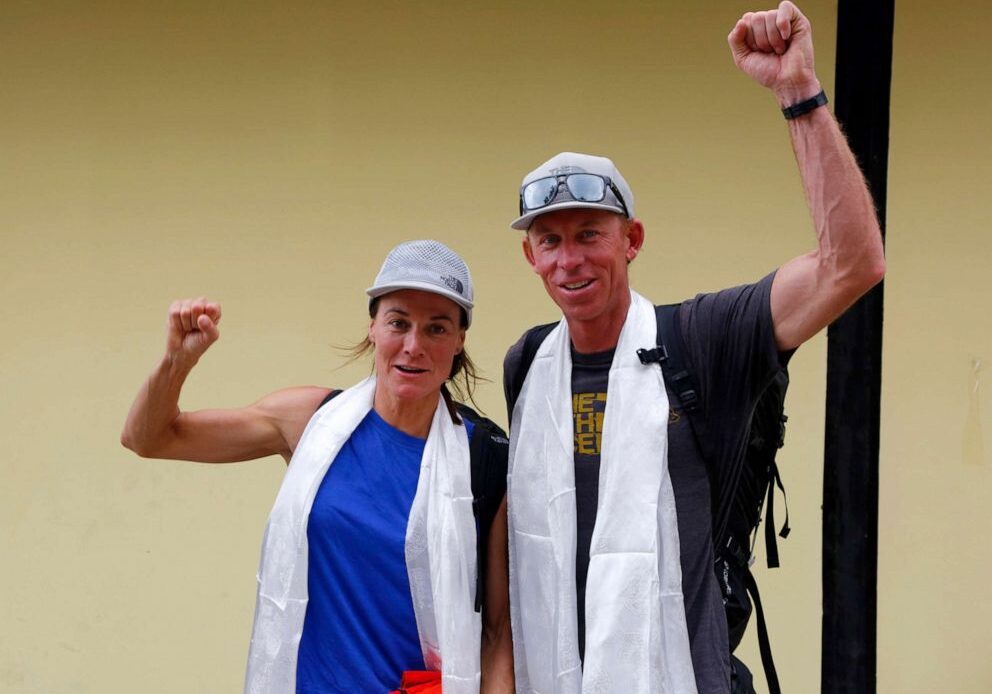 PHOTO: Hilaree Nelson of Telluride, Colorado, and James Morrison of Tahoe, California, raise their fists as the pair arrived in Kathmandu, Nepal, Oct. 4, 2018.