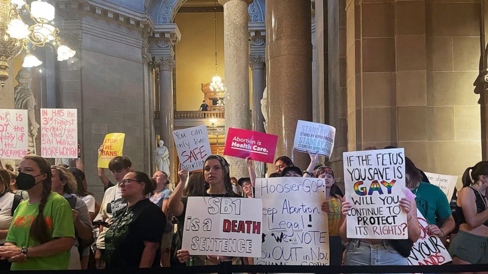 FILE - Abortion-rights protesters fill Indiana Statehouse corridors and cheer outside legislative chambers, Friday, Aug. 5, 2022, as lawmakers vote to concur on a near-total abortion ban, in Indianapolis. An Indiana judge on Thursday, Sept. 22, block