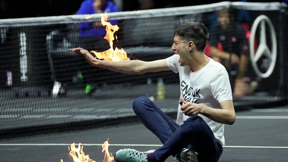 Laver Cup protester sets court, arm on fire, delays match