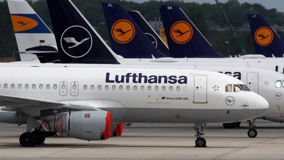 FILE -- Aircrafts of the German airline Lufthansa are parked at the airport in Munich, Germany, Tuesday, May 26, 2020. A union representing pilots at German carrier Lufthansa says they will stage a walk-out Friday after demands for a pay increase wer