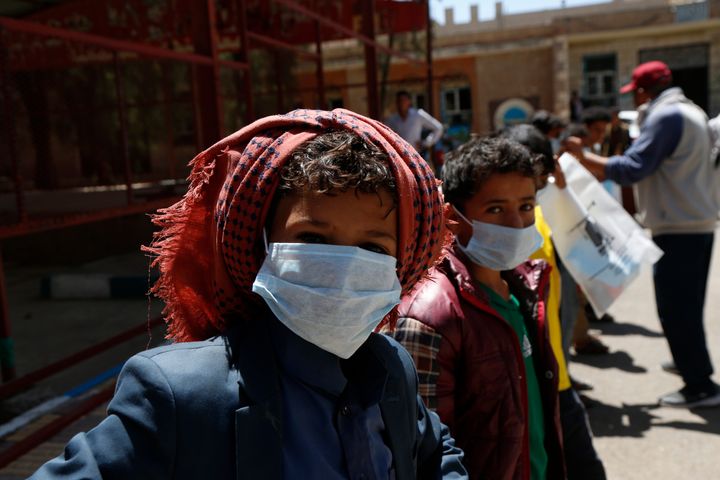 Yemeni children wear masks as precautionary measures against COVID-19 at the orphan center in Sana'a, Yemen, in March 2020.