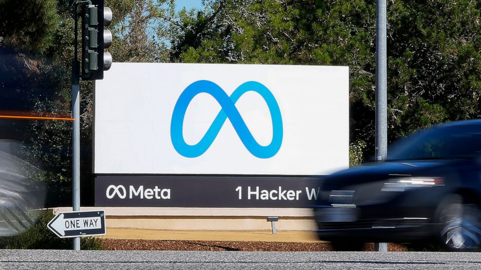FILE - A car passes Facebook's new Meta logo on a sign at the company headquarters on Oct. 28, 2021, in Menlo Park, Calif. For years, Facebook, now called Meta, has pushed a narrative that it was a neutral platform in Myanmar that was misused by bad