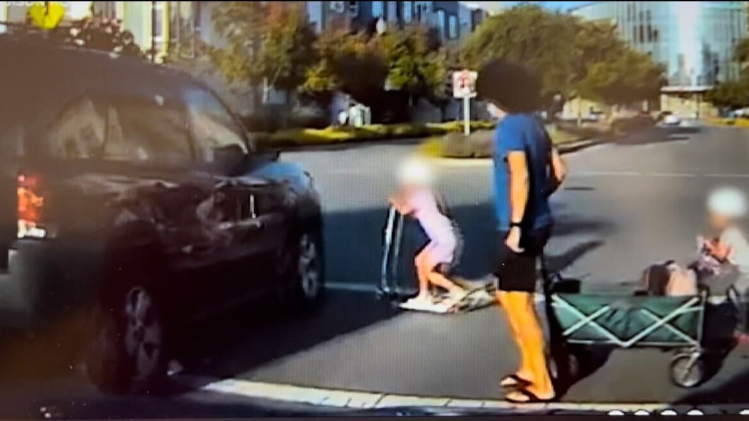 SUV misses child by inches as it barrels through flashing crosswalk