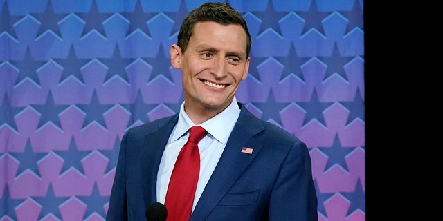 Republican Senate challenger Blake Masters smiles on stage prior to a televised debate with Arizona Democratic Sen. Mark Kelly and Libertarian candidate Marc Victor in Phoenix, Thursday, Oct. 6, 2022. 