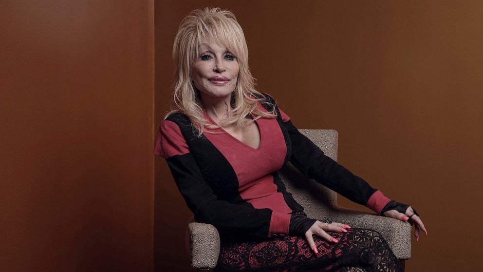 Dolly Parton poses for a picture before the Carnegie Medal of Philanthropy Ceremony at Gotham Hall on Thursday, Oct. 13, 2022, in New York. Parton laughs at the idea that she is some sort of secret philanthropist. “I don’t do it for attention,” she t