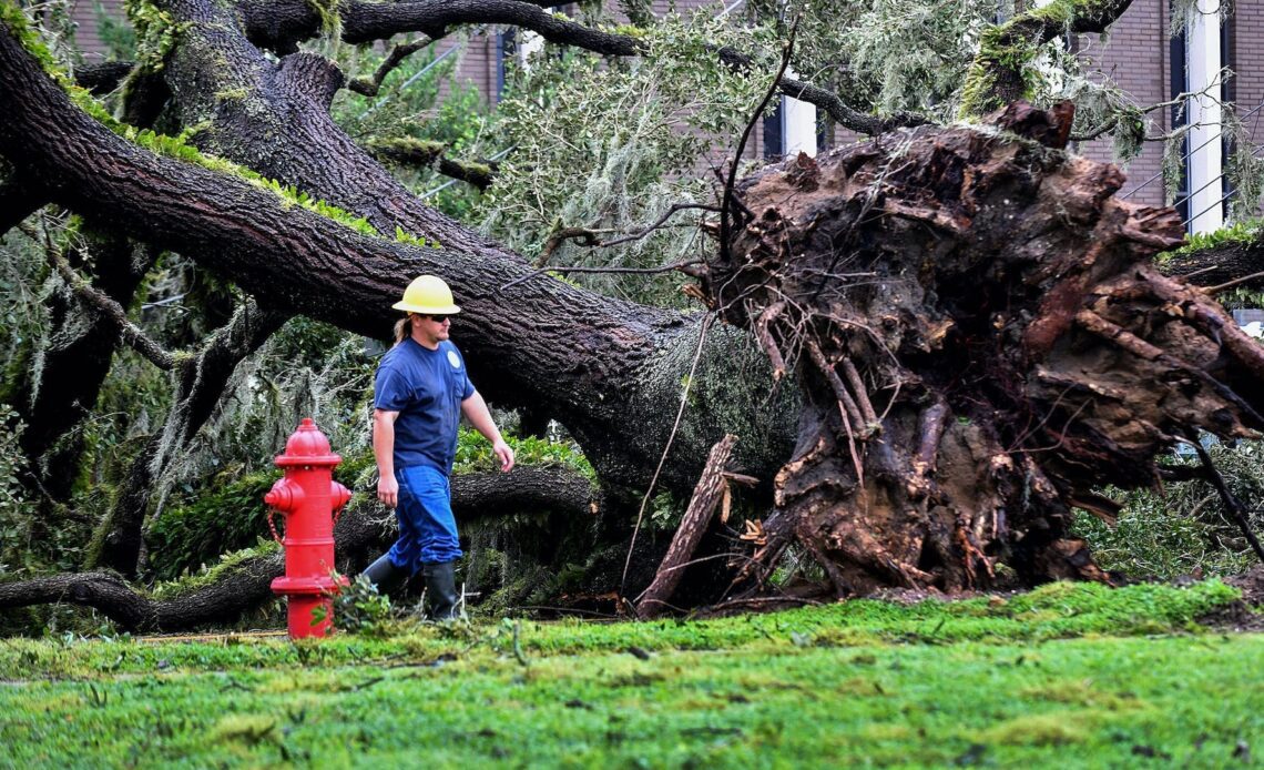 A worker repairs energy lines during a power outage after Hurricane Ian passed through the area on September 29, 2022 in Bartow, Florida. The hurricane brought high winds, storm surge and rain to the area causing severe damage.
