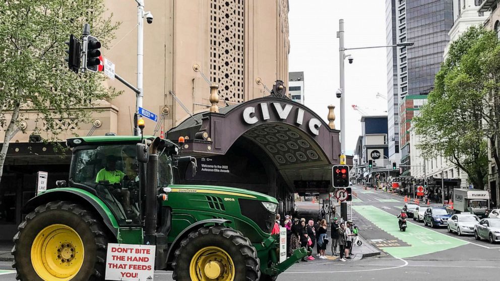 A tractor drives down Queen street in central Auckland during a protest on climate change proposals to make New Zealand farmers pay for greenhouse gas emissions, Thursday, Oct. 20, 2022. New Zealand farmers drove their tractors to towns around New Ze