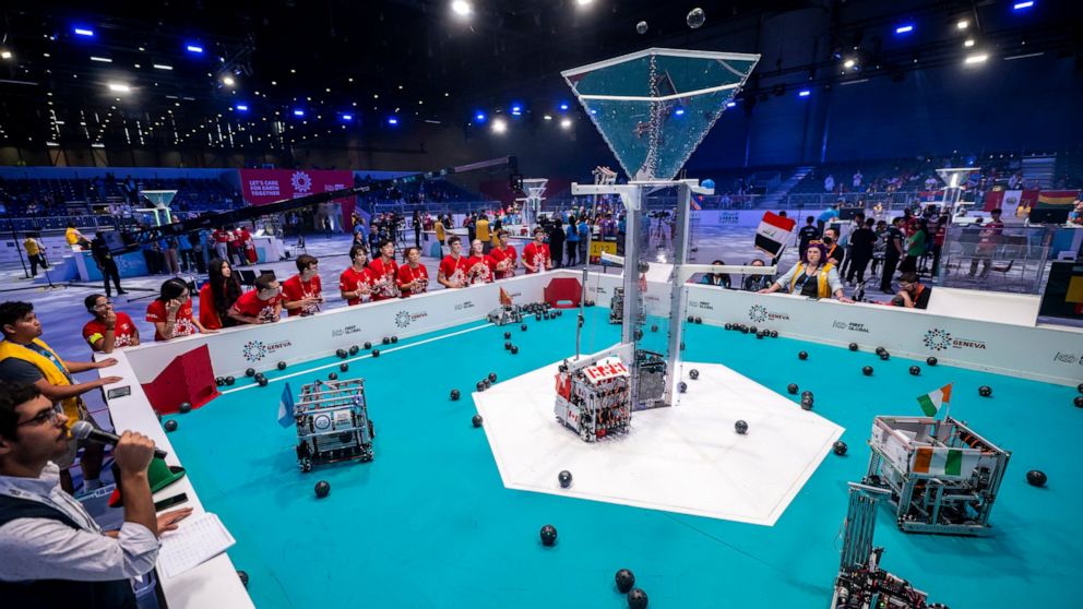 Robots from different teams compete during the 6th edition of the First Global Robotics Challenge in Geneva, Switzerland, Saturday, Oct. 15, 2022. (Martial Trezzini/Keystone via AP)