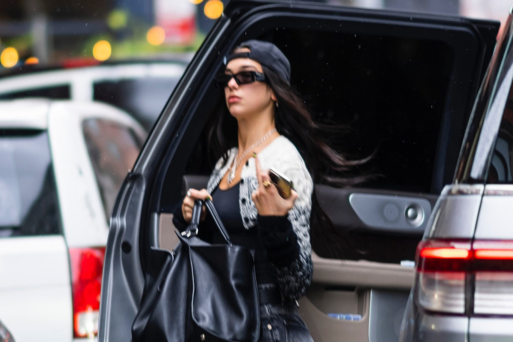 Dua Lipa insists she is single and says she loves being ‘alone’ and ‘quite selfish‘
