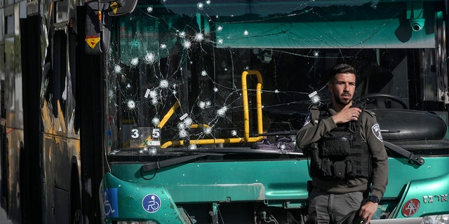 Israeli police inspect the scene of an explosion at a bus stop in Jerusalem, Wednesday, Nov. 23, 2022. 