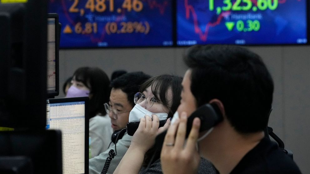 A currency trader watches monitors at the foreign exchange dealing room of the KEB Hana Bank headquarters in Seoul, South Korea, Tuesday, Nov. 15, 2022. Asian stocks gained Tuesday after Wall Street gave back some of last week's huge gains, the Ameri