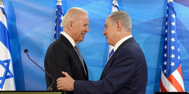 Then-Vice President Joe Biden shakes hands with Israeli Prime Minister Benjamin Netanyahu as they deliver joint statements during their meeting in Jerusalem March 9, 2016.