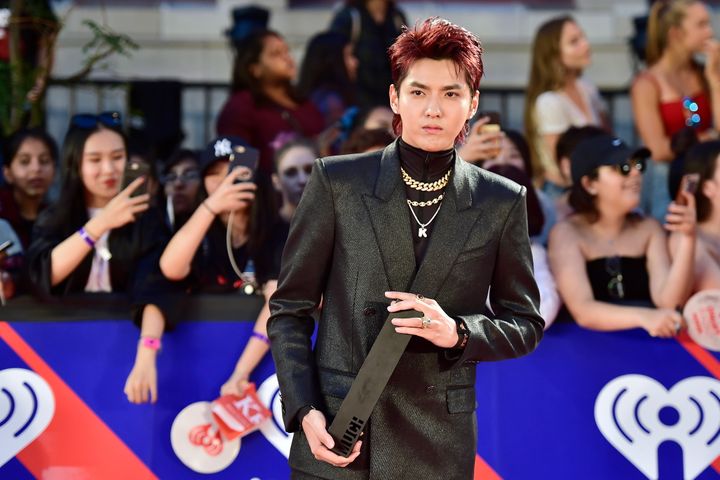 Singer Kris Wu celebrates his award for Fan Fave New Artist on the red carpet at the iHeartRadio MMVAs in Toronto on Aug. 26, 2018.