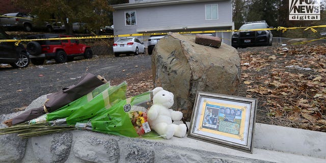 Flowers and a toy bear sit as a memorial in Moscow, Idaho on November 21, 2022, where four students were murdered. 